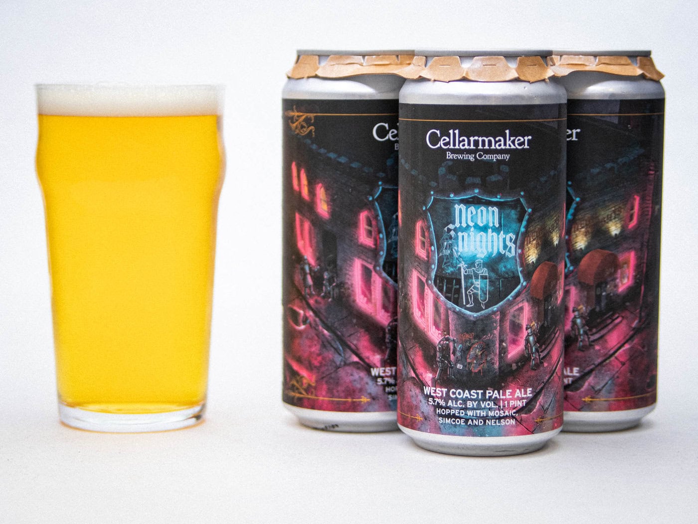 A Pint Glass Filled With Hazy, Golden Beer Sits Next To Three Cans Of Cellarmaker Brewing Company'S &Amp;Quot;Neon Nights&Amp;Quot; West Coast Pale Ale, Featuring Colorful, Neon-Themed Label Art.