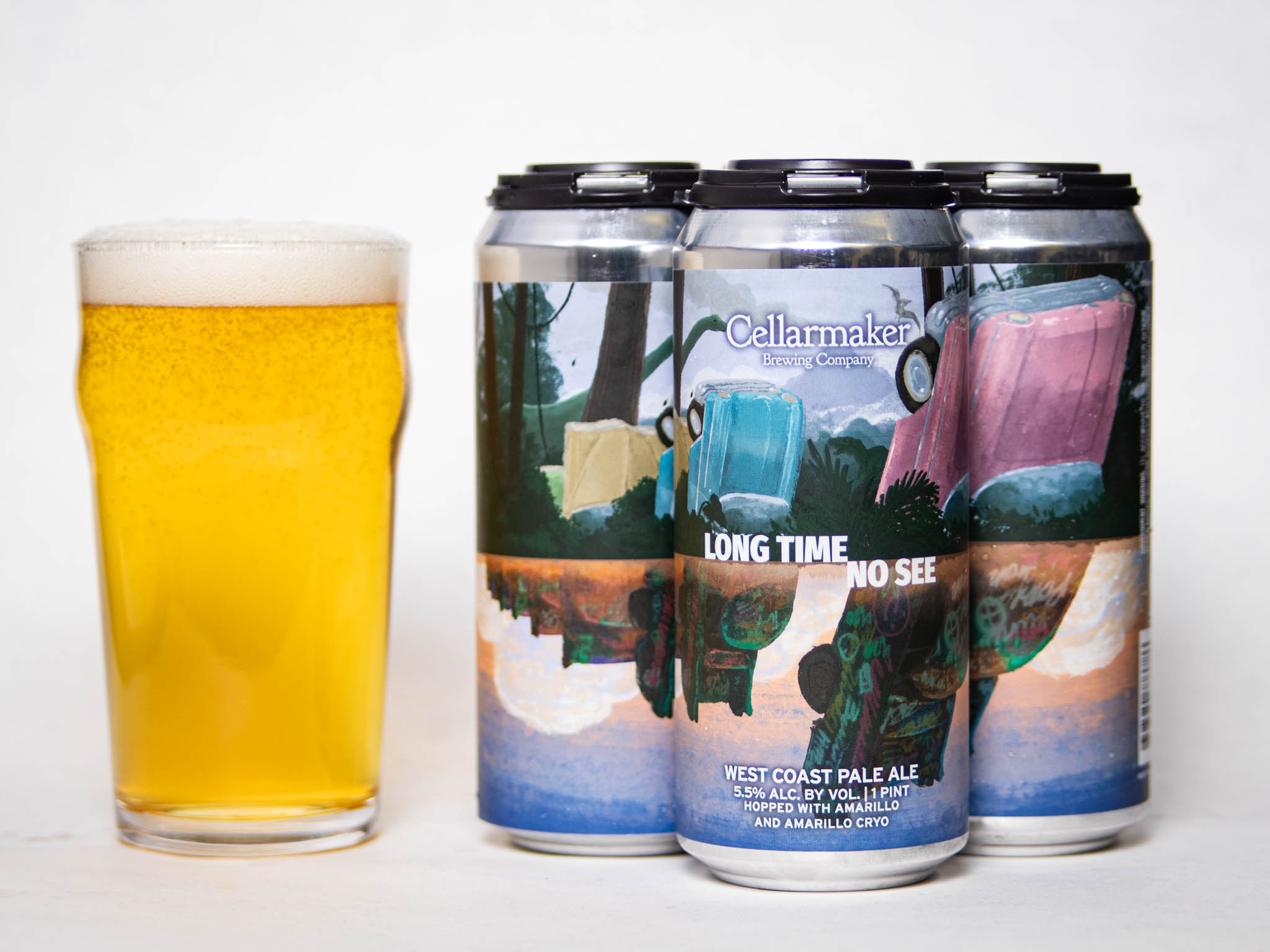 A Pint Glass Filled With Pale Beer Sits Beside A Four-Pack Of Cellarmaker Cans Labeled &Amp;Quot;Long Time No See&Amp;Quot; West Coast Pale Ale, Featuring Colorful, Retro Cars And A Scenic Design On The Cans.